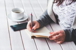 Woman, write, notepad — "Driving Innovation: Dr. Robert Corkern's Contributions to Emergency Medical Technology"
