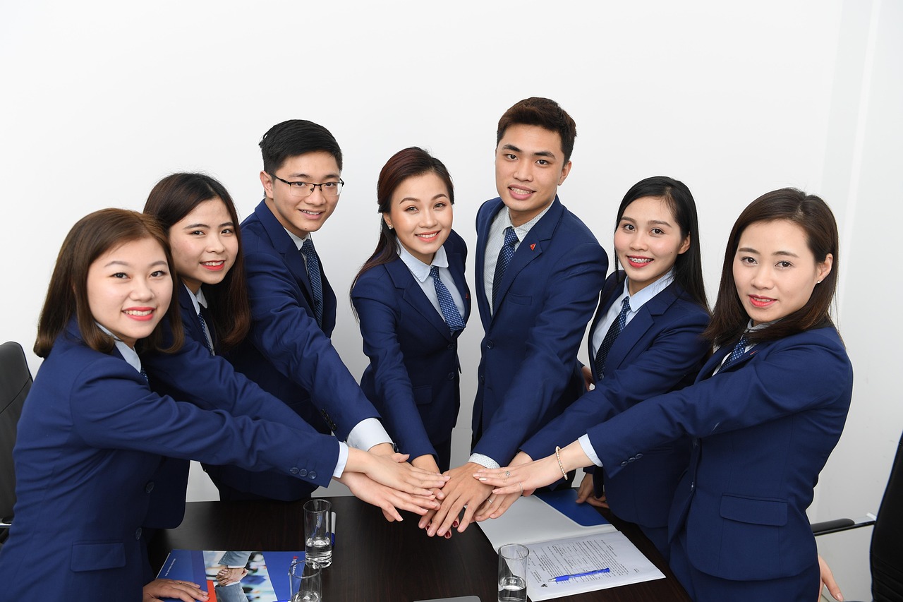 Team, business, asians — Leadership Under Pressure: Benjamin Wey on Legal Strategy